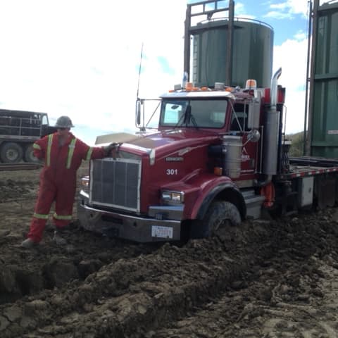 Enviroex spotting tanks on very muddy location