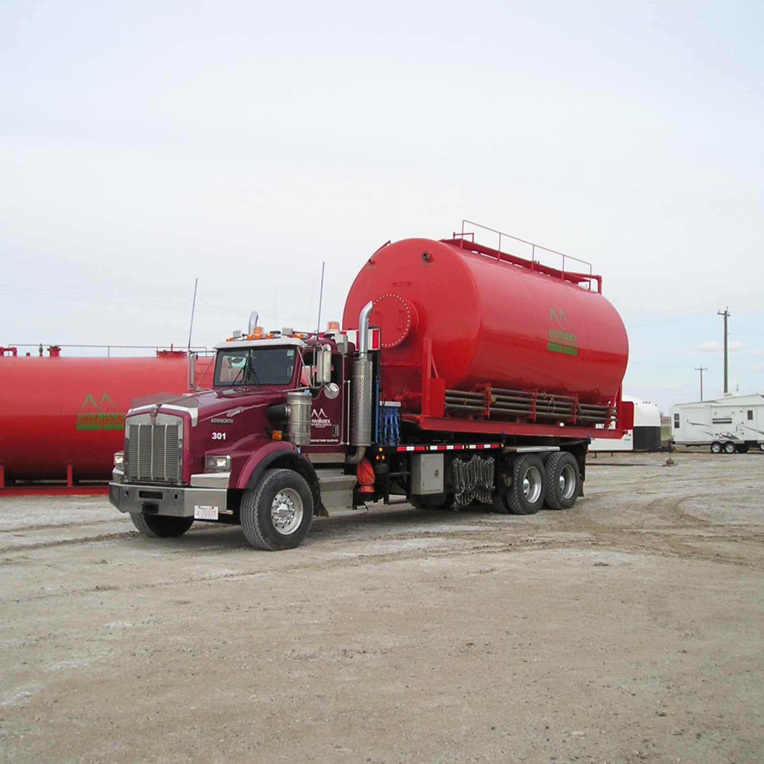 Enviroex tractor with texas trailer unit 301 loaded up with a 300 blow back tank