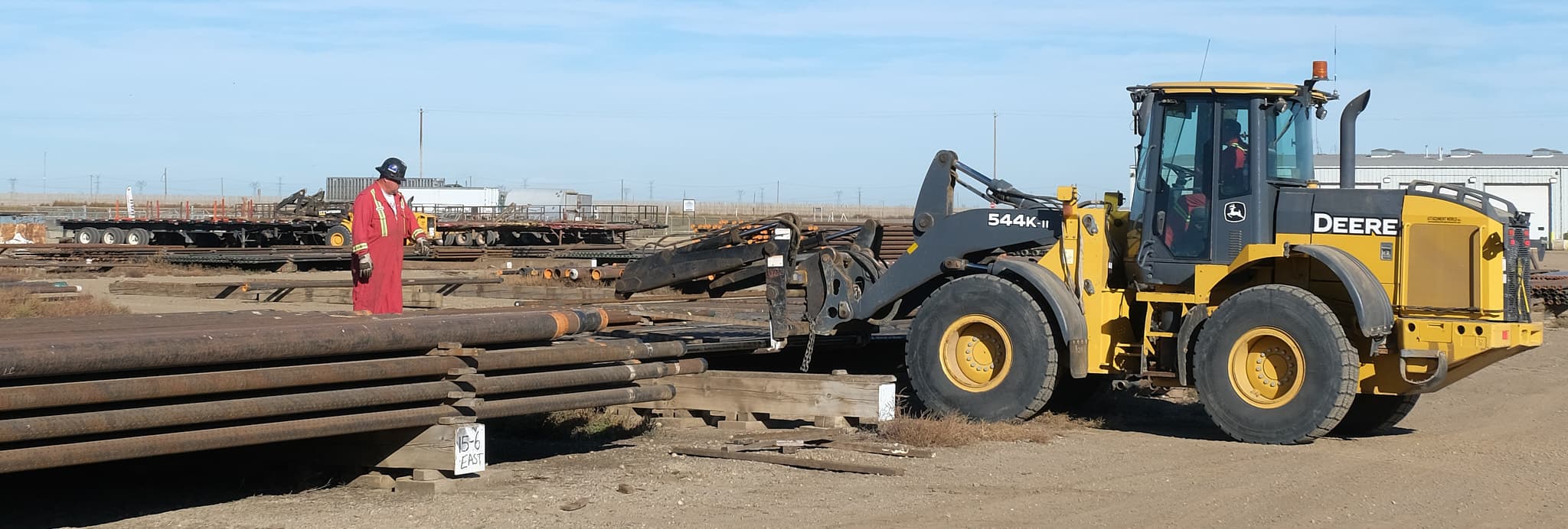 three tractors parked in a row with their grills all pointed toward each other